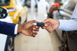 © Prostock-studio - Black Male Customer Taking Car Keys From Seller In Dealership Center, Closeup