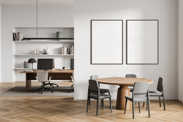 Bright office room interior with two empty white posters