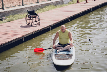 Person with a physical disability ride on sup board