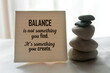 © Maria Marganingsih - Life balance inspirational quote on notepaper - Balance is not something you find. It is something you create. With balancing stone and notes reminder on white table indoor decoration background.