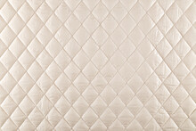 Smooth Surface Of Quilted Jacket Fabric Of Cream Color, Background, Texture