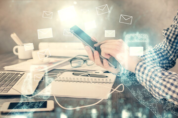 Poster - Double exposure of man's hands holding and using a digital device and envelop hologram drawing. E-mail concept.