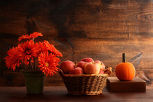 Autumn Setting With Apples In Wicker Basket