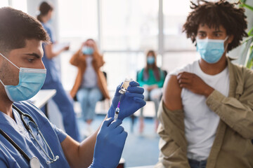 Wall Mural - Doctor With Syringe Taking Dose Of Covid-19 Vaccine From Vial