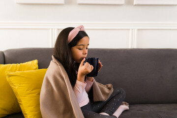 Wall Mural - Side view of a relaxed kid at home