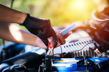 Canvas Print - Car battery checker