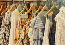 Shopping Concept - Colorful Clothing In A Fancy Store