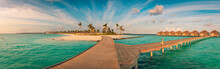 Amazing Sunset Panorama At Maldives. Luxury Resort Villas Seascape With Wooden Bridge Under Colorful Cloudy Sky. Fantastic Travel Hotel Landscape. Panoramic Beach Background For Vacation Holiday