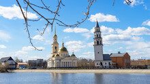 Leaning Tower Of Nevyansk And Old Believers' Church (domed) In Spring Day On The Shore Of The Pond In Sverdlovsk Oblast, Russia