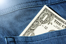 Pocket Money Background. One Dollar Bill. Money In Blue Jeans Trousers. Cash In Trousers. Change Note In Jeans.