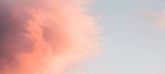 Wall Mural - Background of blue sky with pink clouds in sunset
