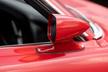 Side View Mirror On Red Classic Car