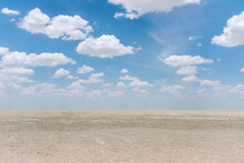 View Of The Desertic And Dry Etosha Pan With Cloudy Sky, Etosha National Park, Namibia.