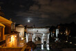 Rome. The Roman Forum at night. In the foreground, the Arch of Septimius Severus
