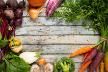 Fresh Organic Carrots And Beetroot With Leaves, Root Vegetables Over Wooden Background, Top View