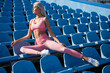© be free - fit lady in fitness wear on stadium after sport workout, dieting