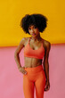© Carlos David - beautiful athletic young black woman in sportswear posing in studio