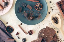 Black And Milk Chocolate, Sweets, Dried Citrus Fruits, Coffee Beans And Spices On The Table, Top View, Home Cooking, Sweet Food
