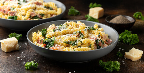 Wall Mural - Fusilli pasta with bacon, kale and parmesan cheese. Healthy food
