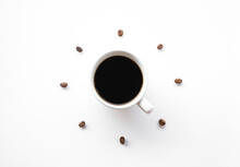 Black Coffee Cup On White Background With Coffee Beans Arrange As Forming Clock Face