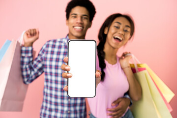 Black couple showing blank empty smartphone screen for mockup