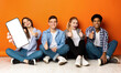 © Prostock-studio - Group Of Teens Sitting On Floor And Demonstrating Blank Smartphone, Mockup