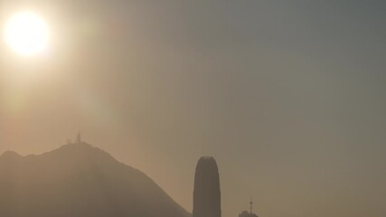 Poster - aerial flying telephoto angle of  Hong Kong city in sunset 
