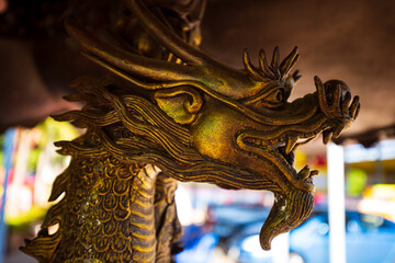 The forged figure of a winged dragon sculpture At worship of temple thailand.