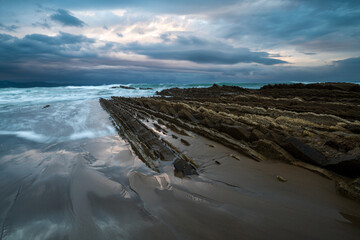 Wall Mural - itzurun beach in zumaia with the famous flysch coast in the basque country