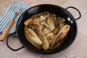 braised endives in pan