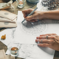 astrology. astrologer calculates natal chart and makes a forecast of fate tarot cards, fortune telli