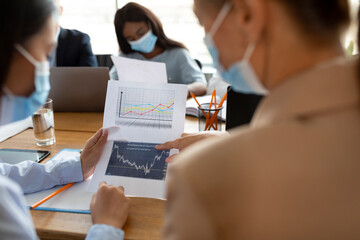 Poster - Business People Wearing Protective Face Masks Working With Documents In Office