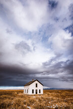 Abandoned House In Lonely Isolated Desert With Clouds, Colorado
