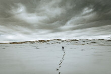 Single Person And Footsteps Clouds, Sand Dunes National Park Colorado