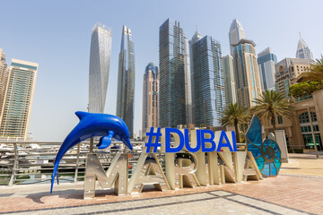 Wall Mural - Dubai Marina logo and Harbour skyline architecture wealth luxury travel in United Arab Emirates