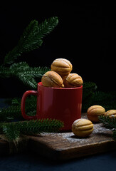 Canvas Print - baked nut-shaped dessert in a red ceramic mug