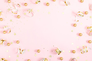 Wall Mural - Pink festive background with gold confetti, sparkles and stars. Party background. Flat lay, top view, copy space