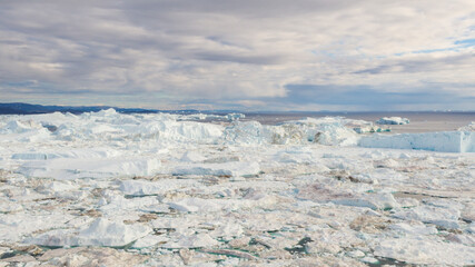 Wall Mural - climate change and global warming. iceberg from glacier in arctic nature landscape on greenland. ice