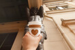 © ksenija1803z - paper cup of natural coffee with carved white heart in women's hand on Palace Square in St. Petersburg