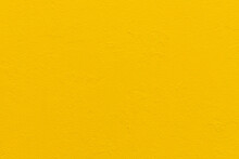 Abstract Bright Yellow Painted Wall Textured Background