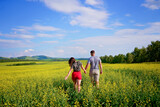 Fototapeta  - couple walking in the field