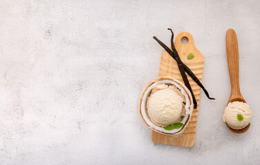 Fototapete - Coconut ice cream flavours in half of coconut setup on white stone background. Summer and Sweet menu concept.