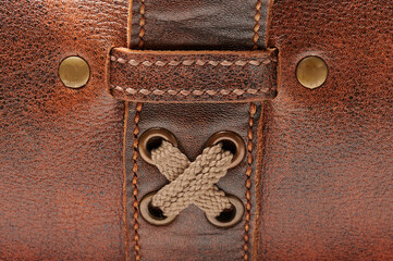 Wall Mural - Cloth buckle and lock on brown leather