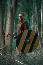 Fearless Viking With Scandinavian Axe And Shield At Battle