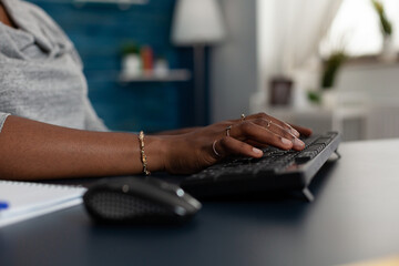 Poster - Close up of hands taking notes on keyboard to work on business project at home office. Employee working with gadget and technology, browsing webiste and doing remote work at desk.