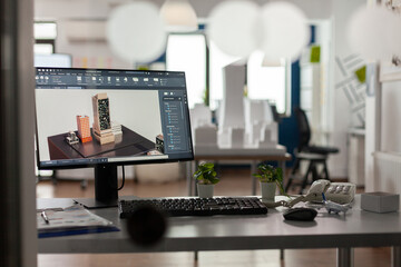 Poster - Closeup of modern architect desk with workstation showing 3d blueprints of architectural building complex. Desktop screen showing model of urban planning architecture construction plan.