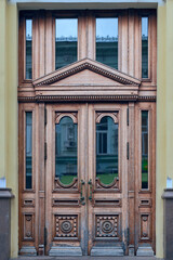 Wall Mural - wooden door with a beautiful decorative finish in the historical part of the Russian city of Kazan