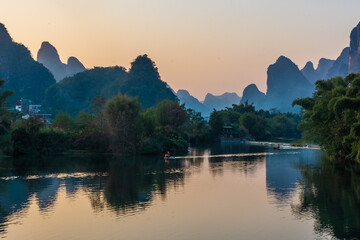 YANGSHUO, CHINA, 6 DECEMBER 2019: Beautiful sunset on the Yulong River in Yangshuo, Guilin, Guangxi