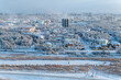 View from the hill to the Yakutsk city in the fog on a cold winter evening