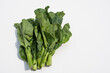 Five collard greens are on a white background.